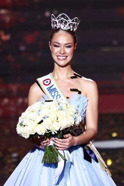 Newly elected Miss France 2026 Miss Tahiti Hinaupoko Deveze reacts after winning the Miss France 2026 beauty pageant at the Zenith, in Amiens, northern France, on December 6, 2025. (Photo by Sameer AL-DOUMY / AFP)