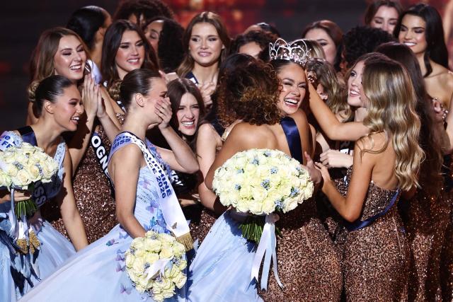 Newly elected Miss France 2026 Miss Tahiti Hinaupoko Deveze (C) celebrates with the other competitors after winning the Miss France 2026 beauty pageant at the Zenith, in Amiens, northern France, on December 6, 2025. (Photo by Sameer AL-DOUMY / AFP)