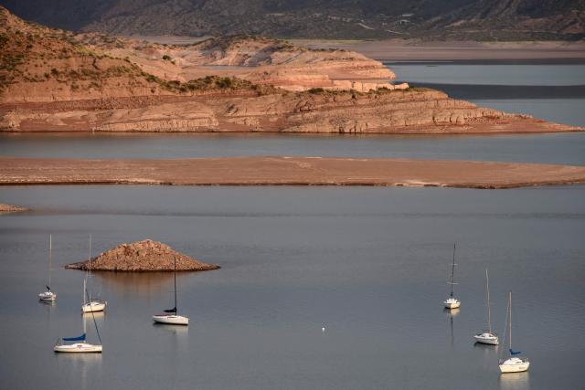 This view shows sailboats on the Potrerillos Reservoir, located 60 km from Mendoza City, Argentina, on December 6, 2025. (Photo by Andres Larrovere / AFP)