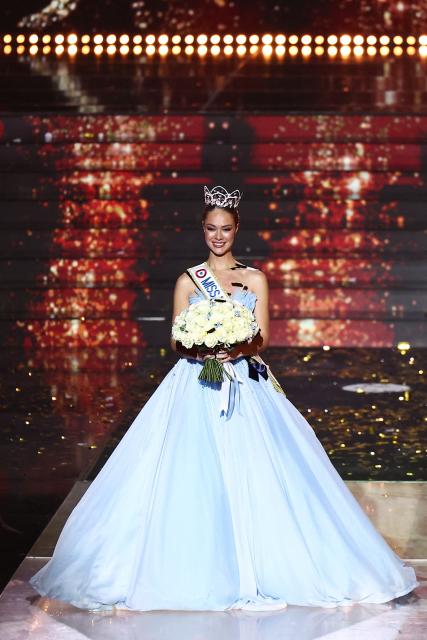 Newly elected Miss France 2026 Miss Tahiti Hinaupoko Deveze reacts after winning the Miss France 2026 beauty pageant at the Zenith, in Amiens, northern France, on December 6, 2025. (Photo by Sameer AL-DOUMY / AFP)