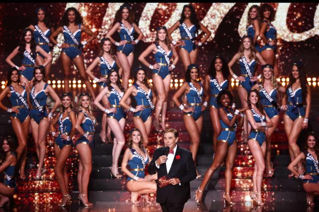 French TV host Jean-Pierre Foucault speaks on stage during the Miss France 2026 beauty pageant at the Zenith, in Amiens, northern France, on December 6, 2025. (Photo by Sameer AL-DOUMY / AFP)