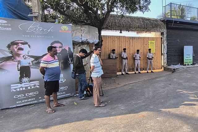 Police personnel stand guard outside a nightclub following a fire that broke out last midnight, in Goa on December 7, 2025. A fire at a nightclub in the west Indian state of Goa has killed at least 23 people, Chief Minister Pramod Sawant and other officials said early December 7. (Photo by AFP)
