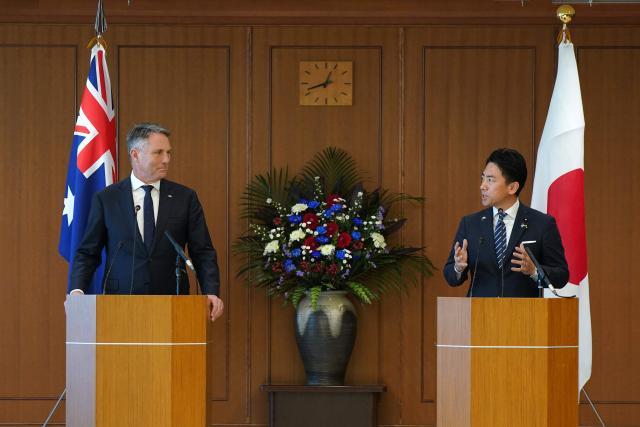 Japan’s Defence Minister Shinjiro Koizumi (R) speaks during a press conference with Australia’s Defence Minister Richard Marles at the Ministry of Defence in Tokyo on December 7, 2025. (Photo by Kazuhiro NOGI / POOL / AFP)