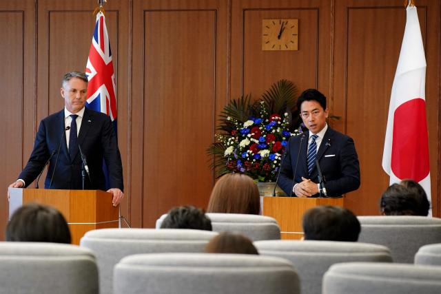 Japan’s Defence Minister Shinjiro Koizumi (R) speaks during a press conference with Australia’s Defence Minister Richard Marles at the Ministry of Defence in Tokyo on December 7, 2025. (Photo by Kazuhiro NOGI / POOL / AFP)