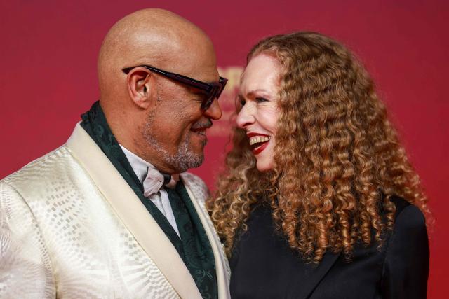 Laurence Fishburne and Bronwyn Dannenfelser pose on the red carpet as they arrive for the closing ceremony of the 22nd Marrakesh Film Festival (FIFM) in Marrakesh on December 6, 2025. (Photo by Abdel Majid BZIOUAT / AFP)