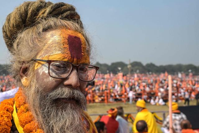 A Sadhu or Hindu holy man participates in a ceremony organised to chant 'Bhagavad Gita', a Hindu holy book, in Kolkata on December 7, 2025. (Photo by Dibyangshu SARKAR / AFP)
