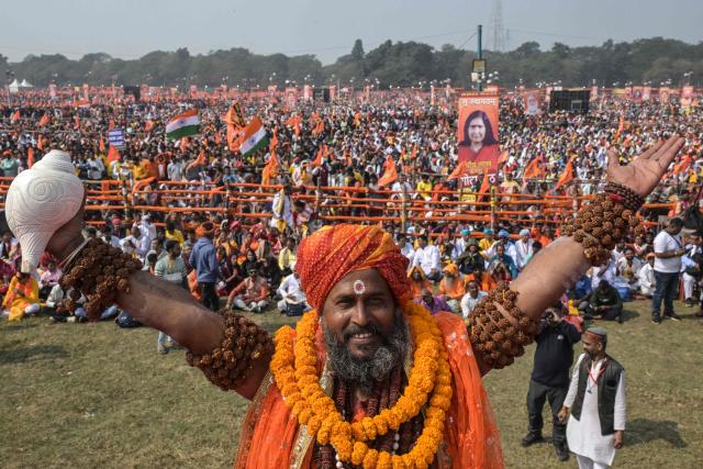 A Sadhu or Hindu holy man participates in a ceremony organised to chant 'Bhagavad Gita', a Hindu holy book, in Kolkata on December 7, 2025. (Photo by Dibyangshu SARKAR / AFP)
