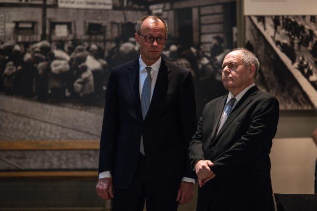 Dani Dayan Dani Dayan,(R), chairman of the Yad Vashem Holocaust Memorial Museum stands with  German Chancellor Friedrich Metz at the museum's Hall of Names in Jerusalem on December 7, 2025. (Photo by JOHN WESSELS / POOL / AFP)