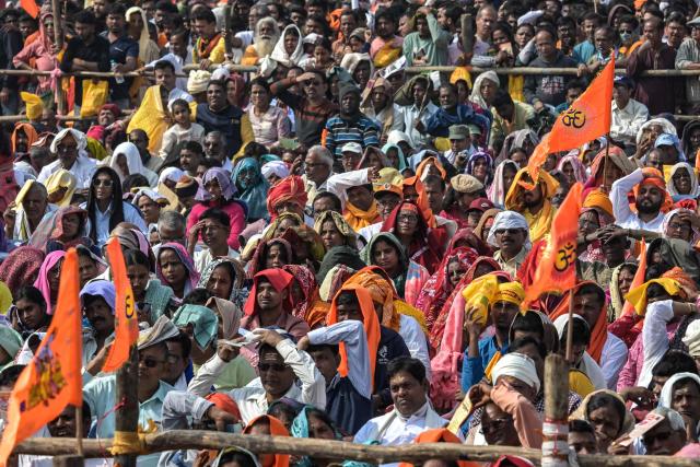 Devotees participate in a ceremony organised to chant 'Bhagavad Gita', a Hindu holy book, in Kolkata on December 7, 2025. (Photo by Dibyangshu SARKAR / AFP)