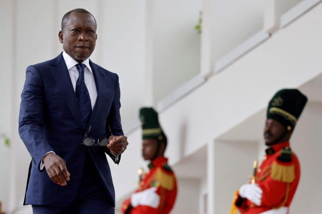 (FILES) Benin's President Patrice Talon waits the arrival of French President at the Marina palace in Cotonou on July 27, 2022. Military personnel in Benin on Sunday announced that they had ousted President Patrice Talon, although his entourage said he was safe and the army was regaining control.
Soldiers calling themselves the "Military Committee for Refoundation" (CMR), said on state television that they had met and decided that "Mr Patrice Talon is removed from office as president of the republic".
The announcement follows two coups in Madagascar and Guinea-Bissau in as many months. Benin is bordered in the north by Niger and Burkina Faso, which have also seen military takeovers.
The French Embassy said on X that "gunfire was reported at Camp Guezo" near the president's official residence in the economic capital. (Photo by Ludovic MARIN / AFP)