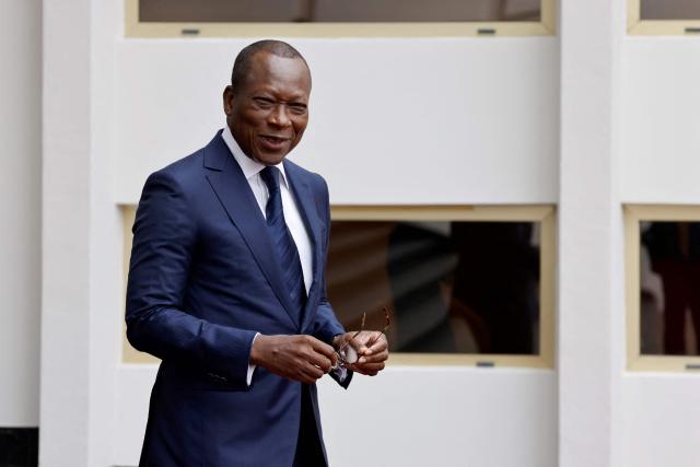 (FILES) Benin's President Patrice Talon waits the arrival of French President at the Marina palace in Cotonou on July 27, 2022. Military personnel in Benin on Sunday announced that they had ousted President Patrice Talon, although his entourage said he was safe and the army was regaining control.
Soldiers calling themselves the "Military Committee for Refoundation" (CMR), said on state television that they had met and decided that "Mr Patrice Talon is removed from office as president of the republic".
The announcement follows two coups in Madagascar and Guinea-Bissau in as many months. Benin is bordered in the north by Niger and Burkina Faso, which have also seen military takeovers.
The French Embassy said on X that "gunfire was reported at Camp Guezo" near the president's official residence in the economic capital. (Photo by Ludovic MARIN / AFP)