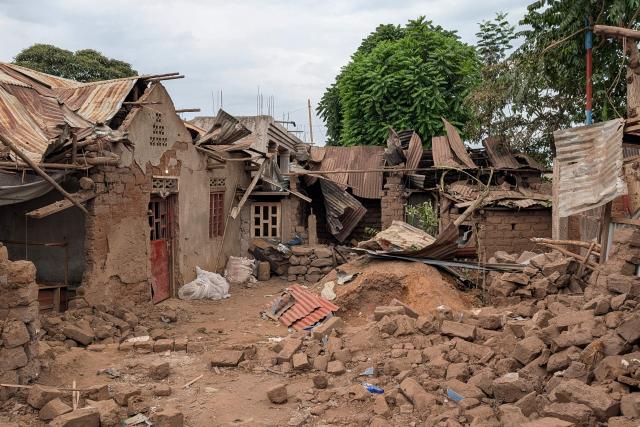A general view of houses destroyed by shelling during intense fighting in Kamnyola on December 7, 2025. At least 20 Burundian soldiers have been killed in ongoing fighting in eastern DR Congo, military sources told AFP on Saturday, only days after a peace deal was signed in Washington.
Thursday's agreement was meant to stabilise the resource-rich east but it has had little visible effect on the ground so far, in an area plagued by conflict for 30 years.
Fighters from the anti-government armed group M23 are battling in South Kivu province with the Congolese army, backed by thousands of Burundian soldiers deployed alongside it.
Both sides are fighting for control of the border town of Kamanyola -- where the Democratic Republic of Congo, Rwanda and Burundi meet. M23 is currently in control there. (Photo by AFP)
