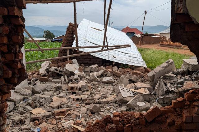 A general view of houses destroyed by shelling during intense fighting in Kamnyola on December 7, 2025. At least 20 Burundian soldiers have been killed in ongoing fighting in eastern DR Congo, military sources told AFP on Saturday, only days after a peace deal was signed in Washington.
Thursday's agreement was meant to stabilise the resource-rich east but it has had little visible effect on the ground so far, in an area plagued by conflict for 30 years.
Fighters from the anti-government armed group M23 are battling in South Kivu province with the Congolese army, backed by thousands of Burundian soldiers deployed alongside it.
Both sides are fighting for control of the border town of Kamanyola -- where the Democratic Republic of Congo, Rwanda and Burundi meet. M23 is currently in control there. (Photo by AFP)