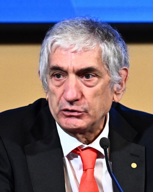 Nobel Prize in Physics 2025 laureate US physicist John M Martinis addresses a press conference at the Royal Swedish Academy of Sciences in Stockholm on December7, 2025, with the Nobel Prize 2025 laureates of Physics, Chemistry and Economics. (Photo by Claudio BRESCIANI / TT News Agency / AFP) / Sweden OUT