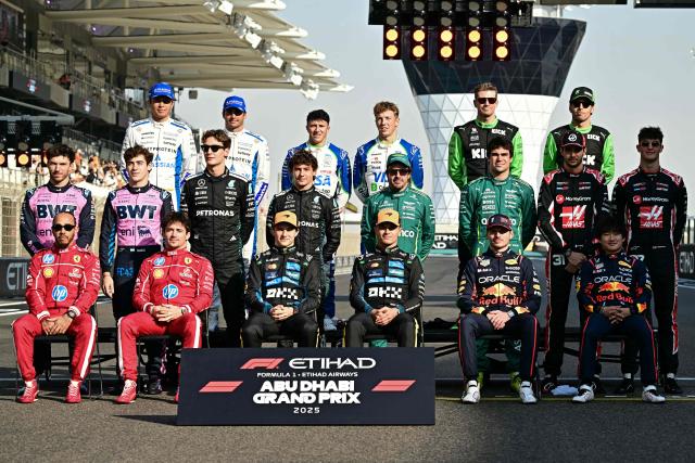Drivers pose for a group photo ahead of the Abu Dhabi Formula One Grand Prix at the Yas Marina Circuit in Abu Dhabi on December 7, 2025. (Photo by Giuseppe CACACE / AFP)