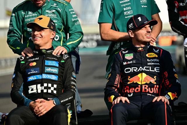McLaren's British driver Lando Norris and Red Bull Racing's Dutch driver Max Verstappen sit for a group photo with other drivers ahead of the Abu Dhabi Formula One Grand Prix at the Yas Marina Circuit in Abu Dhabi on December 7, 2025. (Photo by Giuseppe CACACE / AFP)