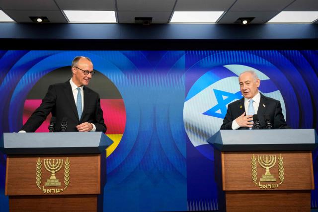 Israeli Prime Minister Benjamin Netanyahu (R) and German Chancellor Friedrich Merz speak to the media during a joint press conference in Jerusalem on December 7, 2025. (Photo by Ariel Schalit / POOL / AFP)