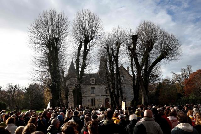 Protesters gather in front of the Château de la Faucherie, which is threatened with demolition,  during a gathering of an environmental collective opposing tree felling at the Faucherie forest in order to comply with European aviation safety regulations, at the Faucherie forest near La Rochelle airport, south-western France, on December 7, 2025. (Photo by ROMAIN PERROCHEAU / AFP)