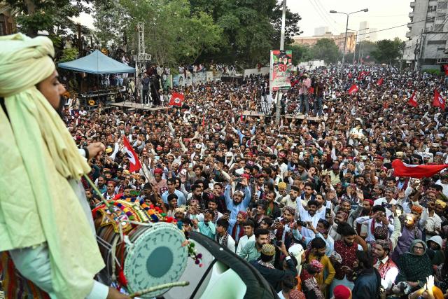 People wearing ethnic attire celebrate Sindhi Cultural Day festival in Karachi on December 7, 2025. (Photo by Asif HASSAN / AFP)