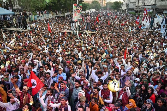 People wearing ethnic attire celebrate Sindhi Cultural Day festival in Karachi on December 7, 2025. (Photo by Asif HASSAN / AFP)
