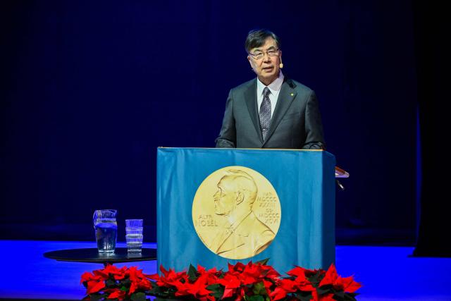 Nobel Prize in Physiology or Medicine 2025 laureate Japanese immunologist Shimon Sakaguchi delivers a speech at the Aula Medica in Stockholm, Sweden, on December 7, 2025.  (Photo by Henrik MONTGOMERY / TT News Agency / AFP) / Sweden OUT