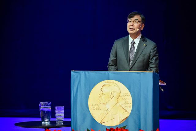 Nobel Prize in Physiology or Medicine 2025 laureate Japanese immunologist Shimon Sakaguchi delivers a speech at the Aula Medica in Stockholm, Sweden, on December 7, 2025.  (Photo by Henrik MONTGOMERY / TT News Agency / AFP) / Sweden OUT