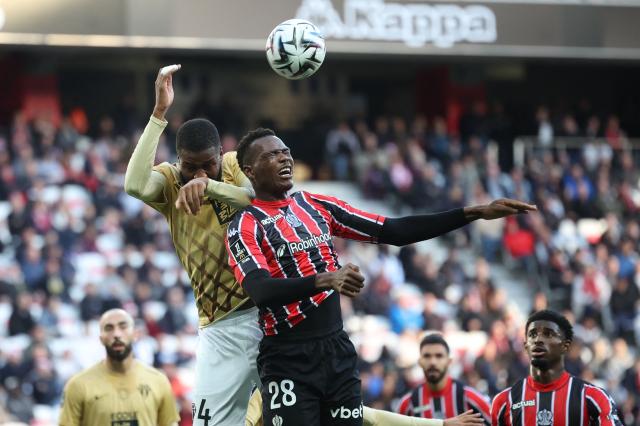 Nice's Sierra Leonean defender #28 Juma Bah (R) fights for the ball with Angers' French-Guinean defender #29 Ousmane Camara (L) during the French L1 football match between OGC Nice and SCO Angers at the Allianz Riviera stadium in Nice, south-eastern France, on December 7, 2025.  (Photo by Valery HACHE / AFP)