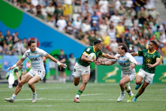 South Africa's Donavan Don runs with the ball during the Men's Cup Finals of the HSBC World Rugby Sevens Series men's rugby match between South Africa and Argentina at the DHL stadium in Cape Town on December 7, 2025. (Photo by GIANLUIGI GUERCIA / AFP)