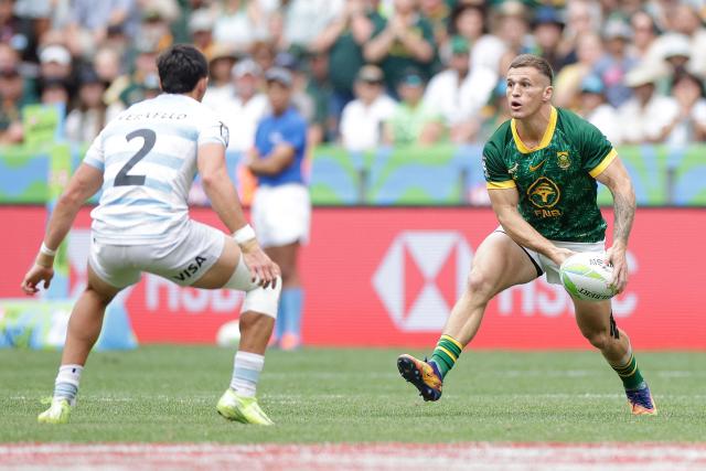 South Africa's Ricardo Duarttee runs with the ball during the Men's Cup Finals of the HSBC World Rugby Sevens Series men's rugby match between South Africa and Argentina at the DHL stadium in Cape Town on December 7, 2025. (Photo by GIANLUIGI GUERCIA / AFP)
