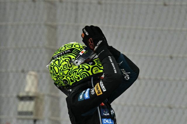 McLaren’s British driver Lando Norris celebrates winning the world championship title at the end of the Abu Dhabi Formula One Grand Prix at the Yas Marina Circuit in Abu Dhabi on December 7, 2025. (Photo by Andrej ISAKOVIC / AFP)