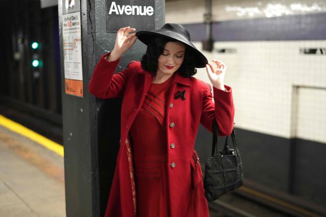 People attend the annual Holiday Nostalgia Rides in the New York City subway system in New York, on December 7, 2025. Every Holiday season, the New York Transit Museum and the NYC Transit Authority offer rides in restored vintage subway cars for a chance to step back in time. The Holiday Nostalgia Rides feature eight cars from the 1930s that served on lettered lines through the late 1970s. (Photo by TIMOTHY A. CLARY / AFP)