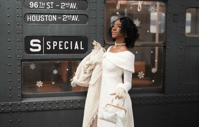 People attend the annual Holiday Nostalgia Rides in the New York City subway system in New York, on December 7, 2025. Every Holiday season, the New York Transit Museum and the NYC Transit Authority offer rides in restored vintage subway cars for a chance to step back in time. The Holiday Nostalgia Rides feature eight cars from the 1930s that served on lettered lines through the late 1970s. (Photo by TIMOTHY A. CLARY / AFP)