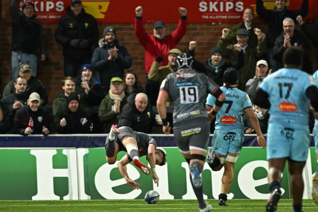 Gloucester's Charlie Atkinson dives over the kine to score a try during the European Rugby Champions Cup pool 2 rugby union match between Gloucester and Castres Olympique at the Kingsholm Stadium in Gloucester on December 7, 2025 (Photo by JUSTIN TALLIS / AFP)
