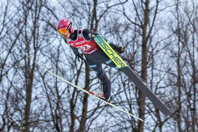 Germany's Felix Hoffman soars through the air during the Men's Large Hill HS134 competition of the FIS Ski Jumping World Cup in Wisla, Poland on December 7, 2025. (Photo by Wojtek RADWANSKI / AFP)