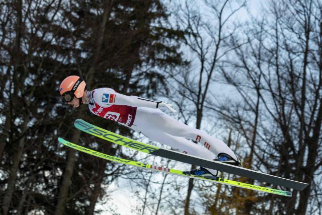 Austria's Jan Hoerl soars through the air during the Men's Large Hill HS134 competition of the FIS Ski Jumping World Cup in Wisla, Poland on December 7, 2025. (Photo by Wojtek RADWANSKI / AFP)