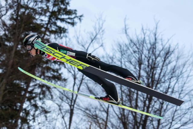 Japan's Ren Nikaido soars through the air during the Men's Large Hill HS134 competition of the FIS Ski Jumping World Cup in Wisla, Poland on December 7, 2025. (Photo by Wojtek RADWANSKI / AFP)