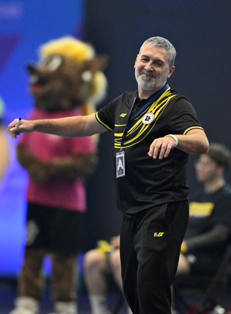 Angola's Spanish coach Carlos Viver Arza reacts during the Group IV main round match between Angola and Sweden of the IHF Women's Handball World Championship in Dortmund, western Germany on December 7, 2025. (Photo by Ina FASSBENDER / AFP)