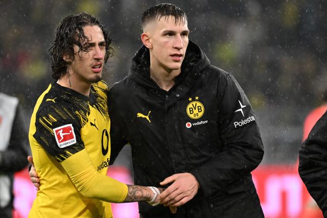 Dortmund's Portuguese forward #21 Fabio Silva (L) and Dortmund's German defender #04 Nico Schlotterbeck react after the end of the German first division Bundesliga football match between BVB Borussia Dortmund and TSG 1899 Hoffenheim in Dortmund, western Germany, on December 7, 2025. (Photo by UWE KRAFT / AFP) / DFL REGULATIONS PROHIBIT ANY USE OF PHOTOGRAPHS AS IMAGE SEQUENCES AND/OR QUASI-VIDEO