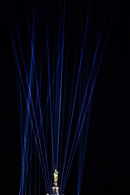 This photograph taken on December 7, 2025 shows a sound and light show origanised to celebrate the inauguration of the statue of the Virgin Mary atop the Basilica of Notre-Dame de la Garde, known to the people of Marseille as Bonne Mere, after its restoration, in Marseille, southern France. (Photo by Thibaud MORITZ / AFP)
