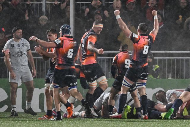 Teammates celebrate as Edinburgh Rugby's South African prop Boan Venter scores a try during the European Rugby Champions Cup pool 2 rugby union match between Edinburgh and Toulon at the Hive Stadium in Edinburgh on December 7, 2025 (Photo by ANDY BUCHANAN / AFP)