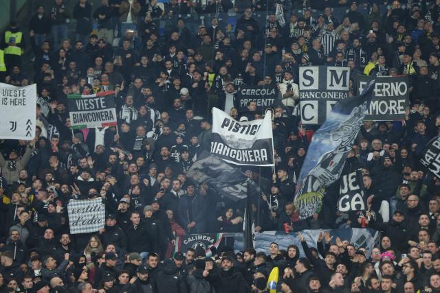 Juventus' supporters cheer during the Italian Serie A football match between SSC Napoli and Juventus FC at the Diego Armando Maradona Stadium in Naples, on December 7, 2025. (Photo by CARLO HERMANN / AFP)
