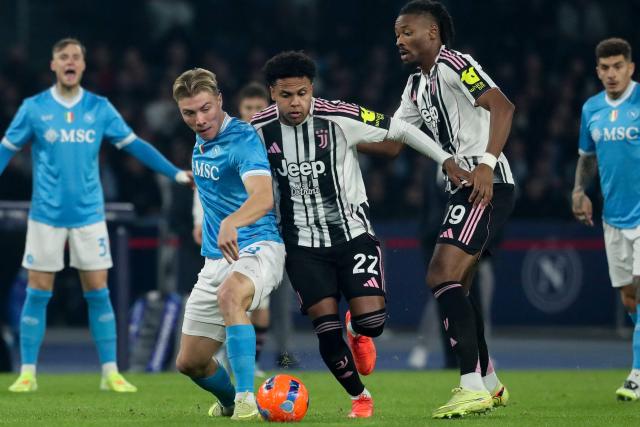 Napoli's Danish forward #19 Rasmus Hojlund (C-L) fights for the ball with Juventus' US midfielder #22 Weston McKennie (C-R) and Juventus' French midfielder #19 Khephren Thuram (R) during the Italian Serie A football match between SSC Napoli and Juventus FC at the Diego Armando Maradona Stadium on December 7, 2025. (Photo by CARLO HERMANN / AFP)