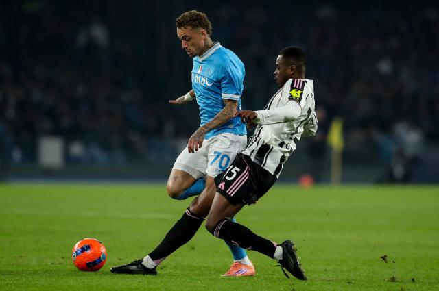 Napoli's Dutch forward #70 Noa Lang (L) fights for the ball with Juventus' French defender #15 Pierre Kalulu during the Italian Serie A football match between SSC Napoli and Juventus FC at the Diego Armando Maradona Stadium in Naples, on December 7, 2025. (Photo by CARLO HERMANN / AFP)