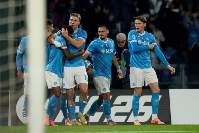 Napoli's Danish forward #19 Rasmus Hojlund (C) celebrates with teammates after scoring his team's first goal during the Italian Serie A football match between SSC Napoli and Juventus FC at the Diego Armando Maradona Stadium in Naples, on December 7, 2025. (Photo by CARLO HERMANN / AFP)