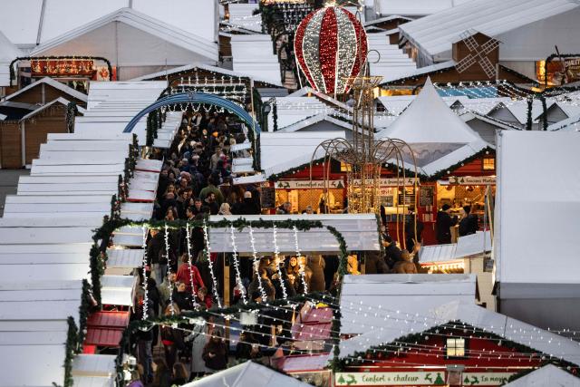 This photograph shows a general view of the Christmas market on the Parvis de la Defense, in the business district of La Defense, in Puteaux outside Paris, on December 7, 2025. (Photo by Ian LANGSDON / AFP)