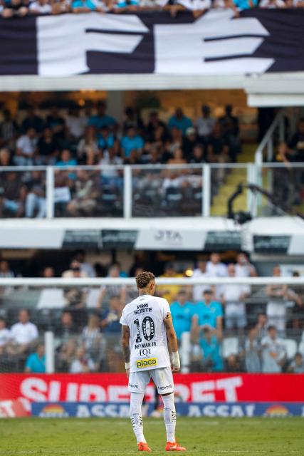 Santos' forward #10 Neymar looks on during the Brasileirao Serie A football match between Santos and Cruzeiro at the Urbano Caldeira Stadium in Santos, Sao Paulo state, Brazil on December 7, 2025. (Photo by Miguel Schincariol / AFP)