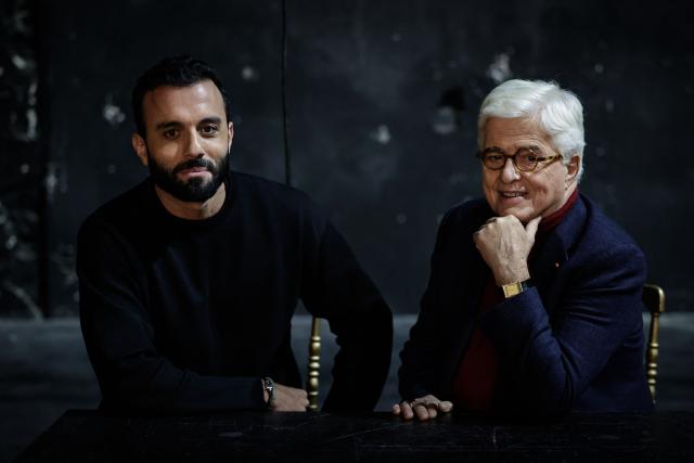 Embargoed until December 8, 2025 - 04:00 GMT / Mickael Chetrit (L), new owner of the Palace theatre flanked by French architect and interior designer Jacques Garcia pose during a photo session at the Palace theatre in Paris on December 4, 2025. The Palace concert hall, a legendary venue of Parisian nightlife that has been abandoned for two years, will reopen its doors at the end of 2026 after a year of renovation, announced its new owner Mickael Chetrit to AFP. (Photo by STEPHANE DE SAKUTIN / AFP)