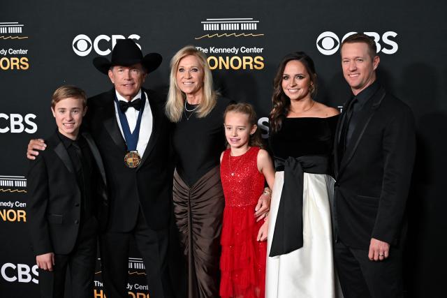US country music singer and Kennedy Center Honoree George Strait (2L) and his wife Norma Strait (3L) arrive with family for the 48th Kennedy Center Honors gala at the Kennedy Center in Washington, DC, on December 7, 2025. (Photo by Alex WROBLEWSKI / AFP)