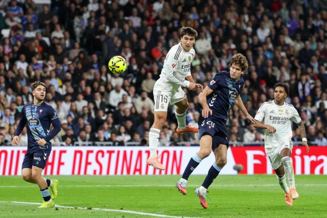 Real Madrid's Spanish forward #16 Gonzalo Garcia and Celta Vigo's Spanish defender #20 Marcos Alonso Mendoza (2R) go for a header during the Spanish league football match between Real Madrid CF and RC Celta de Vigo at the Santiago Bernabeu Stadium in Madrid on December 7, 2025. (Photo by Thomas COEX / AFP)