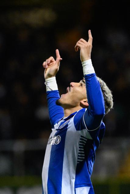 FC Porto's Brazilian forward #07 William Gomes celebrates scoring their second goal during the Portuguese League football match between between CD Tondela and FC Porto at at the Joao Cardoso stadium in Tondela on December 7, 2025. (Photo by Miguel RIOPA / AFP)